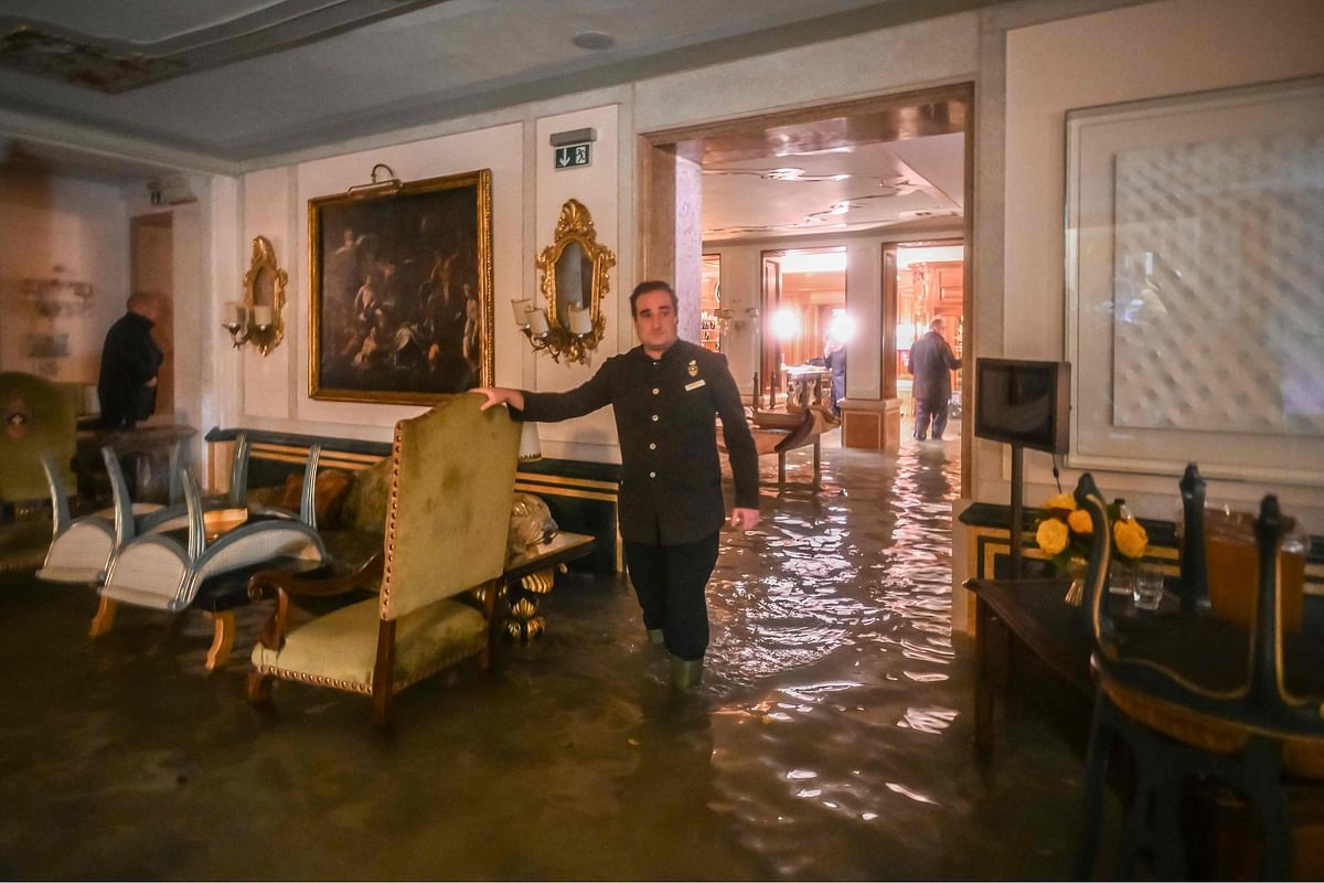 A room in the flooded Gritti Palace is pictured during an exceptional `Alta Acqua` high tide water level on 12 November in Venice. Photo: AFP