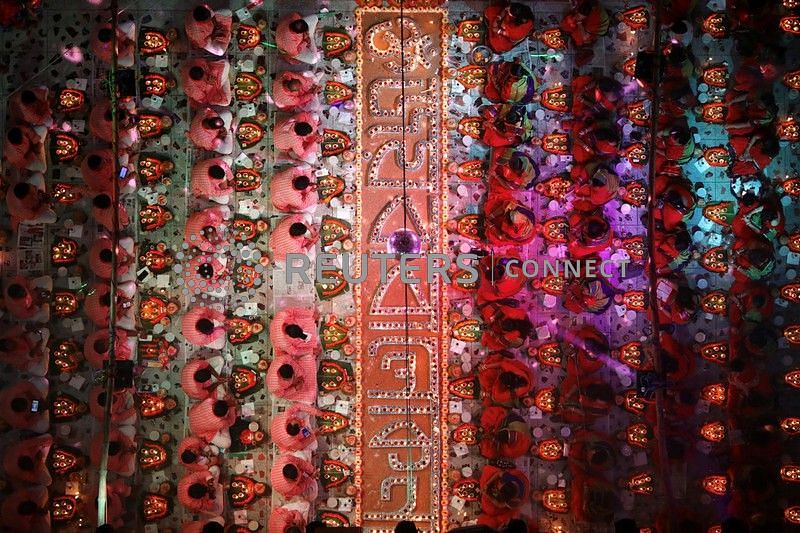 Hindu devotees sit together on the floor of a temple to observe Rakher Upabash, in Dhaka, Bangladesh, 12 November 2019. Photo: Reuters
