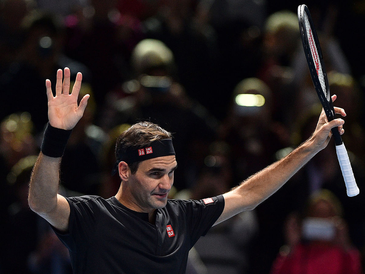 Switzerland`s Roger Federer celebrates winning against Italy`s Matteo Berrettini during their men`s singles round-robin match on day three of the ATP World Tour Finals tennis tournament at the O2 Arena in London on Tuesday. Photo: AFP