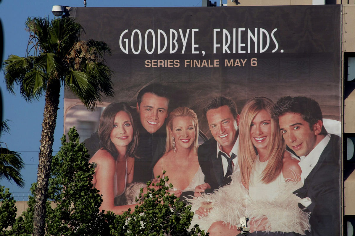 The cast of the popular comedy television series `Friends,` which will end its ten year run on 6 May 2004, are pictured on a giant billboard promoting the series finale, at the NBC television network office in Burbank, California, 3 May 2004. Photo: Reuters