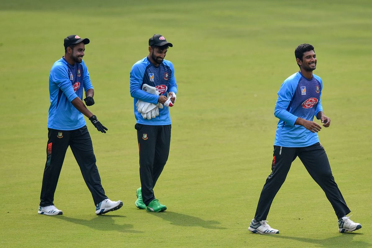 Bangladesh cricketers, (L-R) Mohammad Mithun (L), Shadman Islam (C) and Mahmudullah jog during a training session ahead of the first Test match between India and Bangladesh at Holkar Cricket Stadium in Indore on 13 November 2019. Photo: AFP