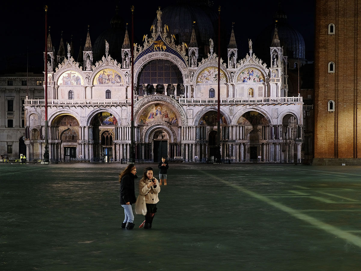 A flooded St Mark`s Square is pictured during a period of seasonal high water in Venice, Italy on 12 November. Photo: Reuters