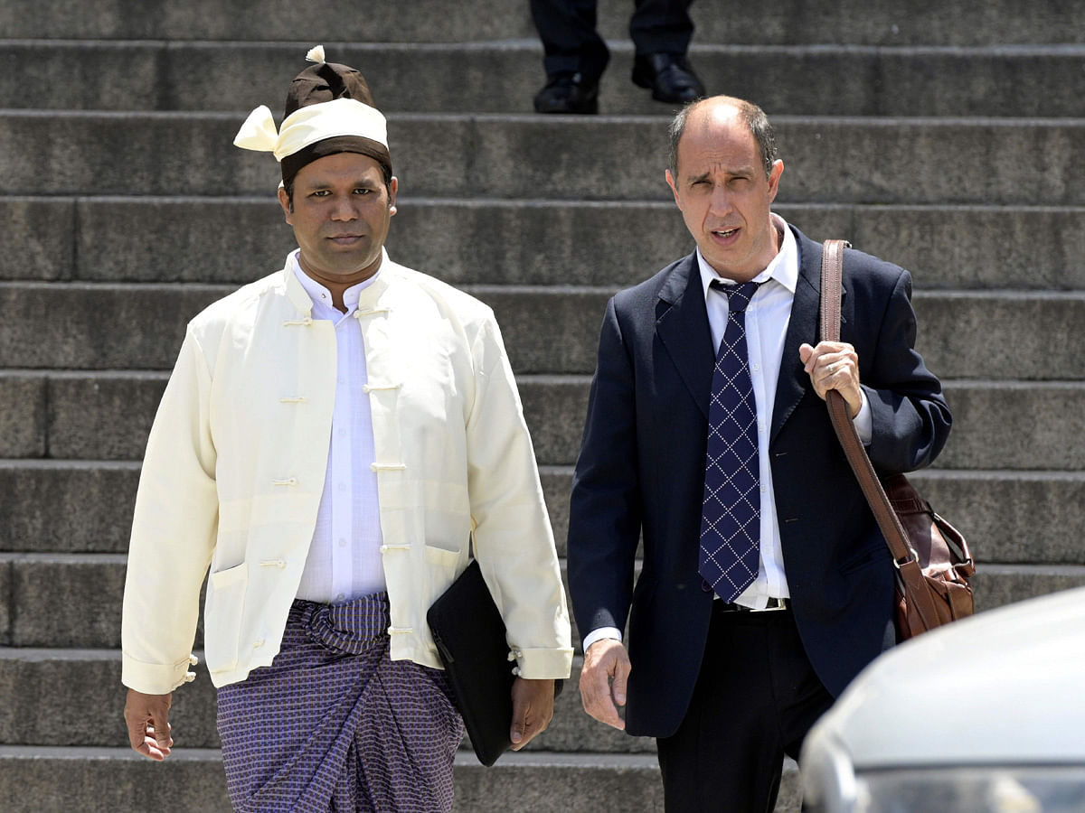 The President of The Burmese Rohingya Organisation UK (BROUK), Tun Khin (L) and Argentine human rights lawyer Tomas Ojea Quintana (R) leave Argentine federal court in Buenos Aires on 13 November 2019. Photo: AFP