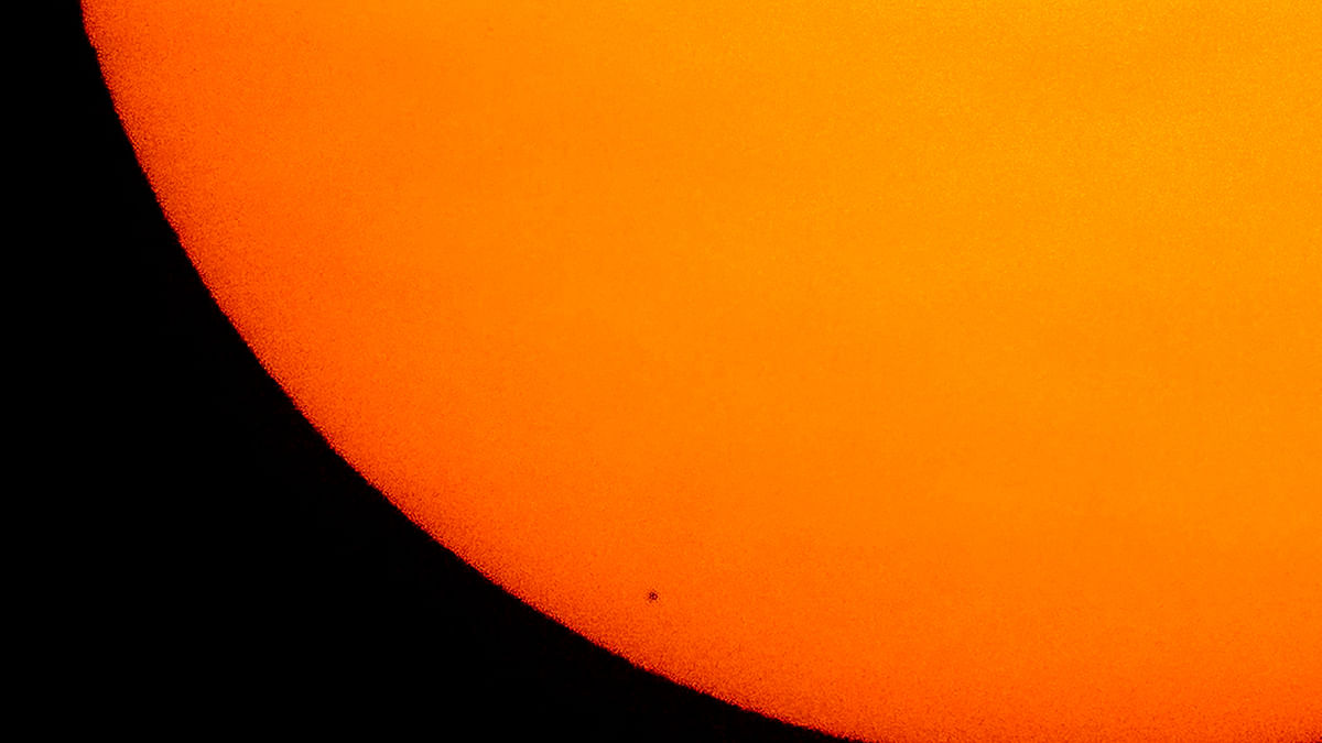 This NASA photo received on 11 November 2019 shows the planet Mercury in silhouette, low center, as it transits across the face of the Sun on 11 November 2019, from Washington, DC. Photo: AFP