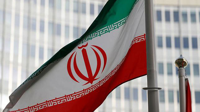 The Iranian flag flutters in front the International Atomic Energy Agency (IAEA) headquarters in Vienna, Austria on 4 March. Photo: Reuters