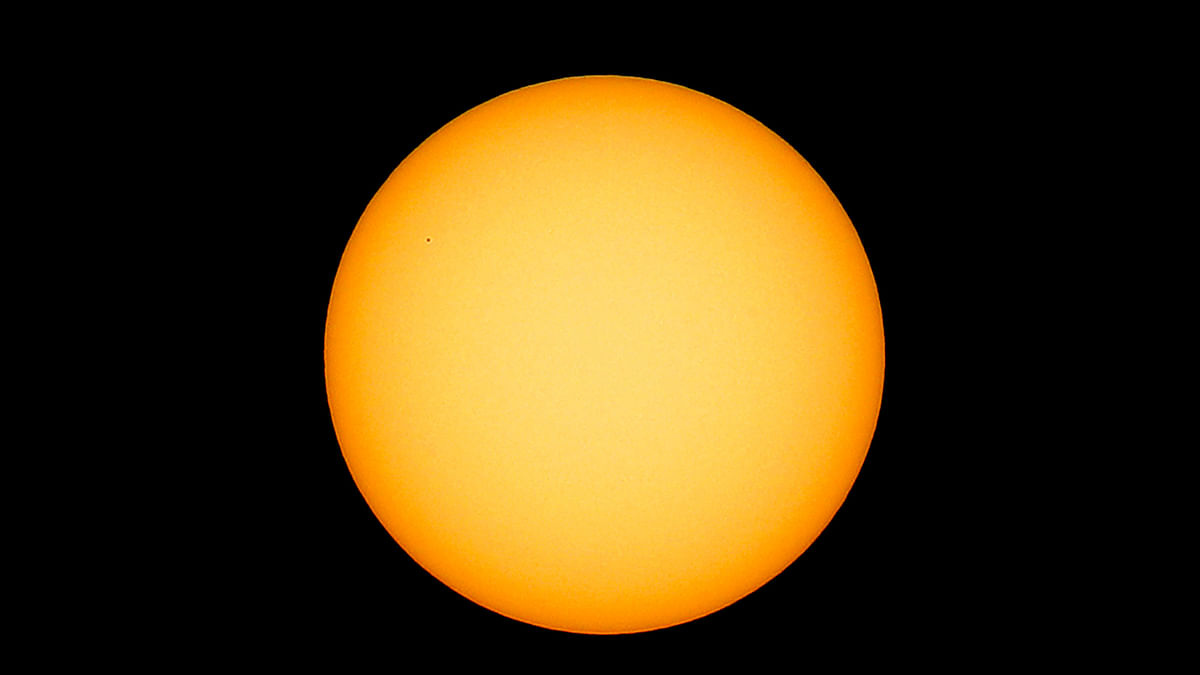 A picture taken on 11 November 2019 from Ovda in southern Israel shows the transit of the planet Mercury (top L) in front of the Sun. Photo: AFP
