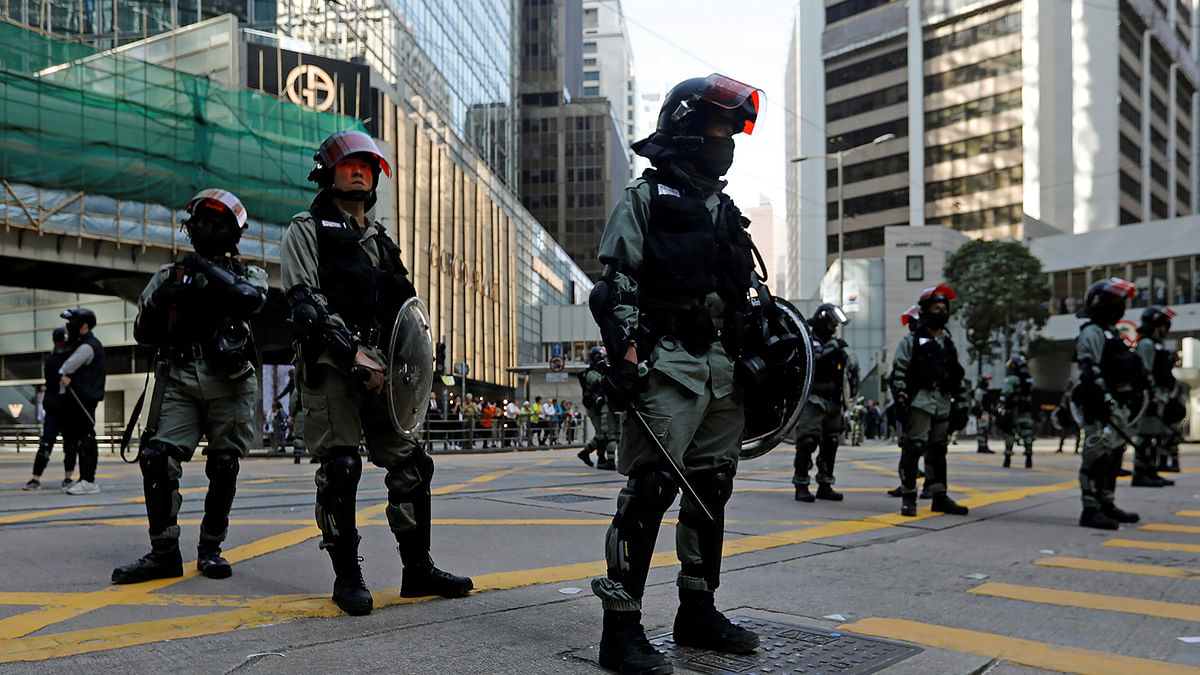 Riot police stand in the middle of a street in Central district in Hong Kong, China, on 15 November 2019. Photo: Reuters