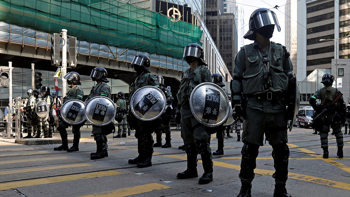 Riot police stand in the middle of a street in Central district in Hong Kong, China, on 15 November 2019. Photo: Reuters