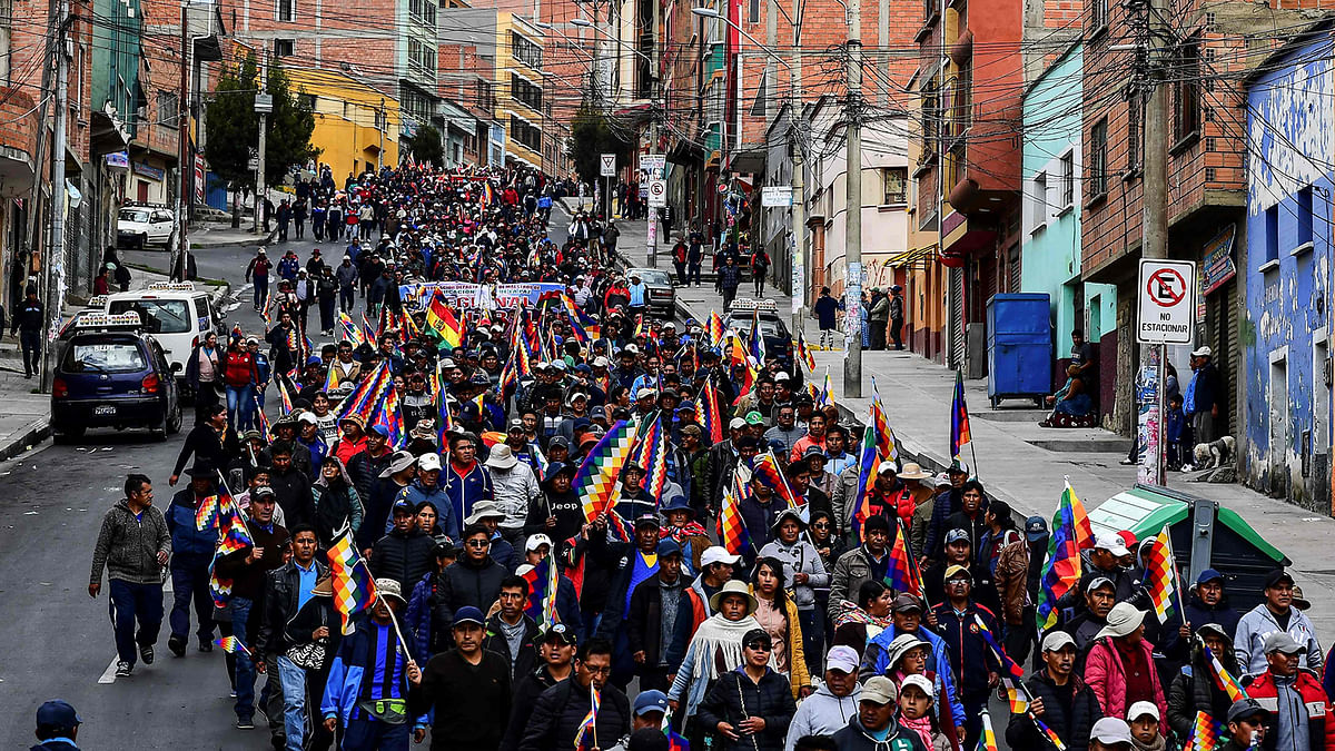 Supporters of Bolivian ex-president Evo Morales and locals discontented with the political situation march during a protest from El Alto to La Paz on 13 November 2019. Photo: AFP