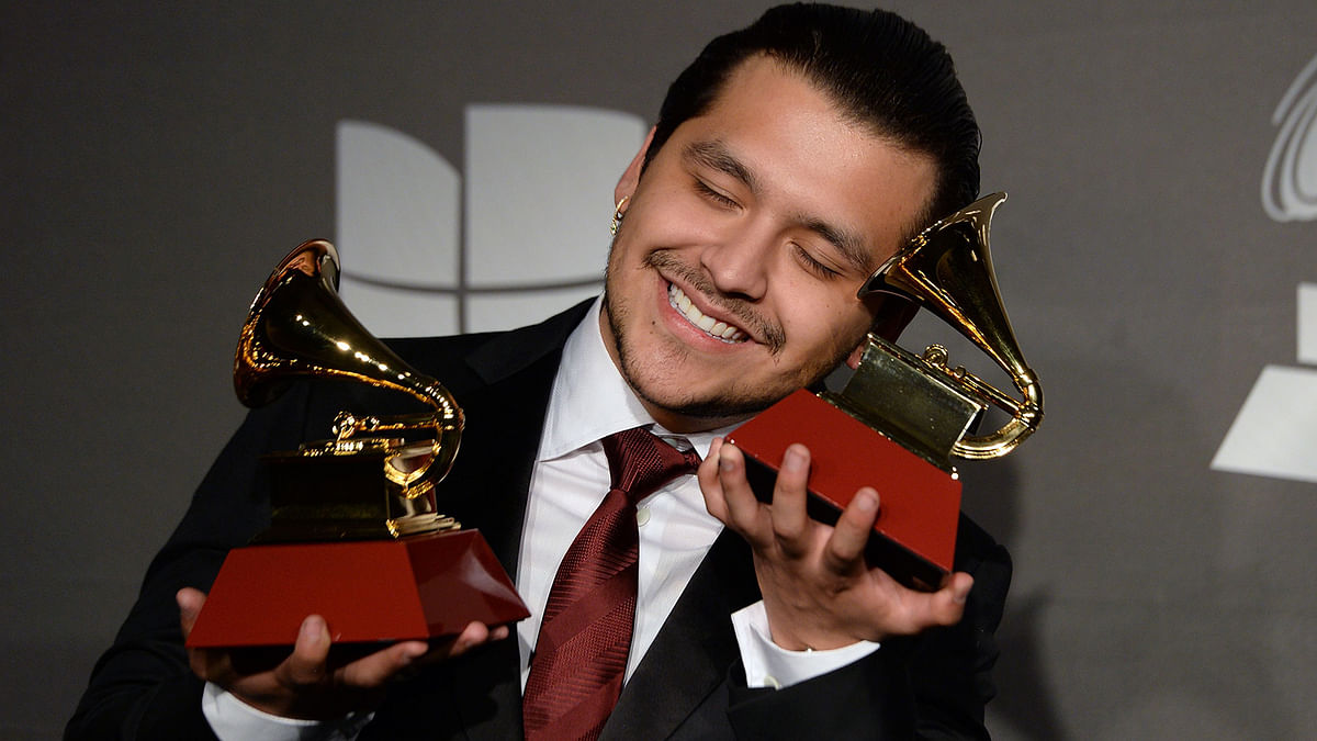 Mexican musician Christian Nodal poses in the press room with the awards for `Best Ranchero/Mariachi Album` and `Best Regional Mexican Song` during the 20th Annual Latin Grammy Awards in Las Vegas, Nevada, on 14 November 2019. Photo: AFP