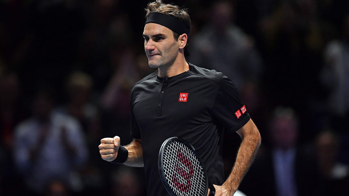 Switzerland`s Roger Federer celebrates his straight sets win over Serbia`s Novak Djokovic in their men`s singles round-robin match on day five of the ATP World Tour Finals tennis tournament at the O2 Arena in London on 14 November 2019. Photo: AFP