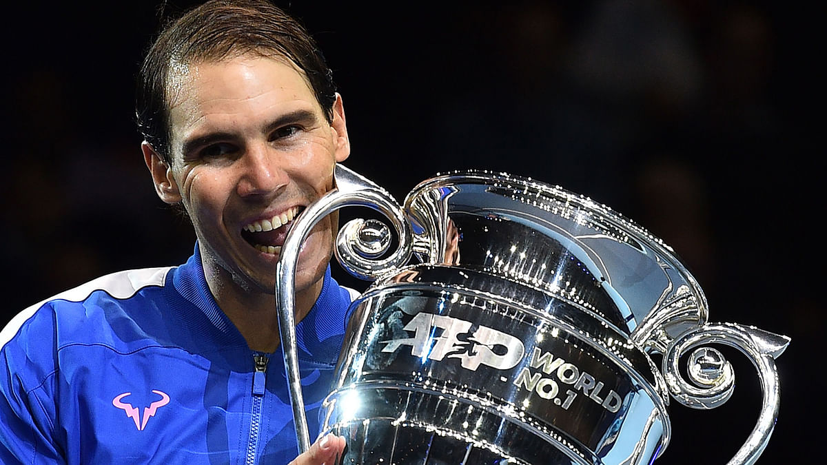 Spain`s Rafael Nadal holds up the 2019 ATP Tour Year-End Number One trophy at a presentation ceremony on day six of the ATP World Tour Finals tennis tournament at the O2 Arena in London on 15 November 2019. Photo: AFP