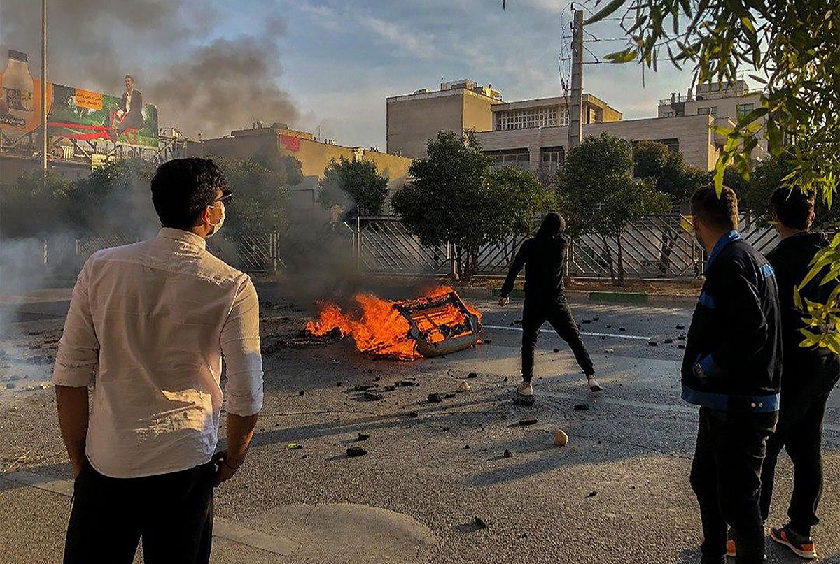 Iranian protesters block a road during a demonstration against an increase in gasoline prices in the central city of Shiraz on Saturday. Photo: AFP