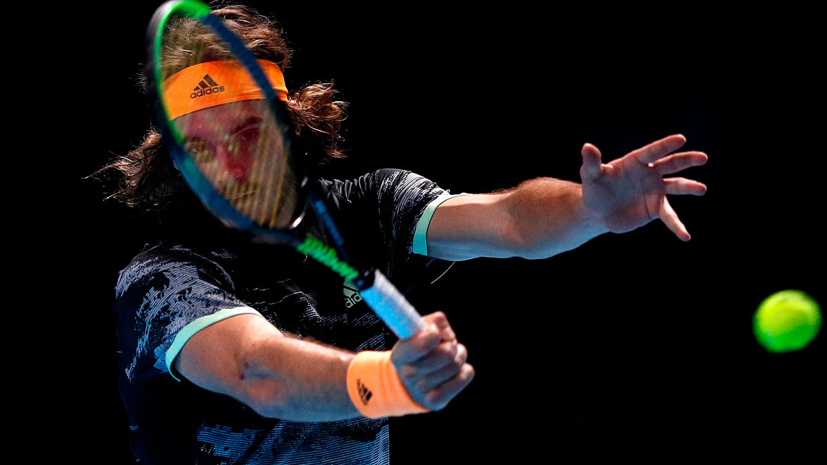Greece`s Stefanos Tsitsipas returns against Germany`s Alexander Zverev during their men`s singles round-robin match on day four of the ATP World Tour Finals tennis tournament at the O2 Arena in London on 13 November 2019. Photo:AFP