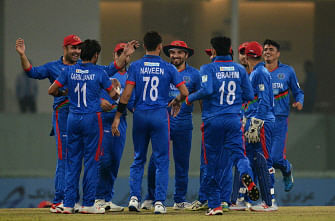Afghanistan`s players celebrate the dismissal of West Indies` cricketer Evin Lewis (unseen) during the second T20 international cricket match of a three-match series between Afghanistan and West Indies at Ekana Cricket Stadium in Lucknow on 16 November, 2019. Photo: AFP