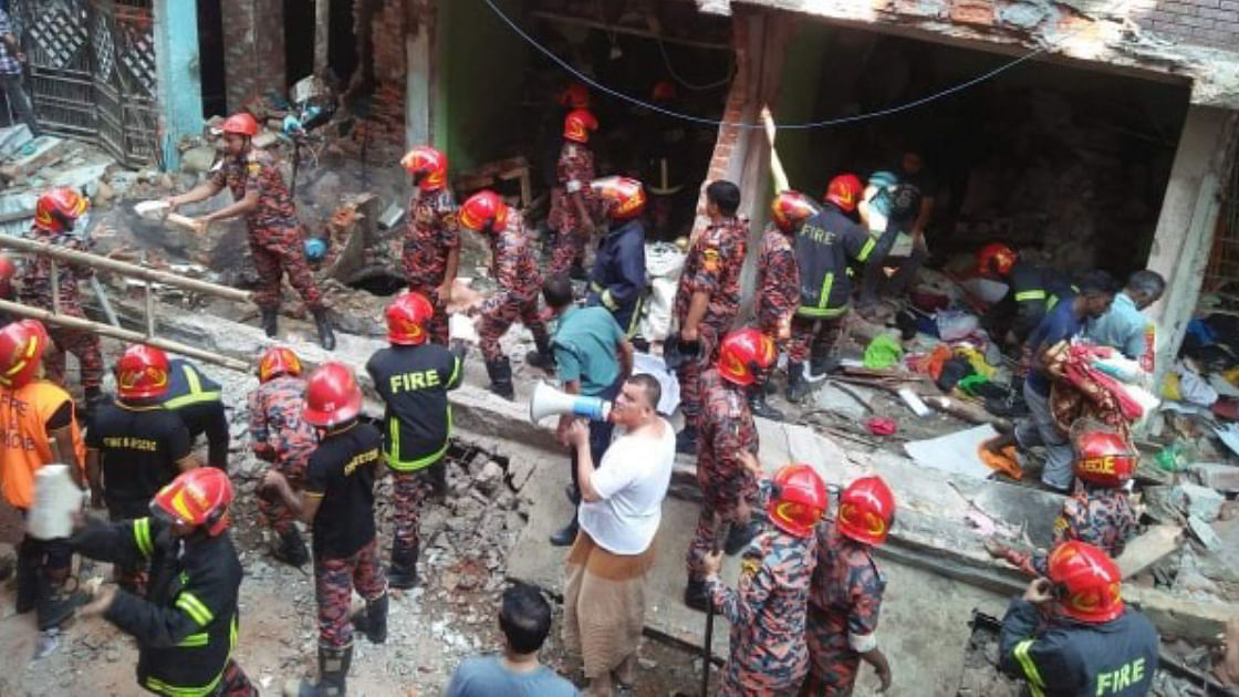 Fire service men carry out rescue works at the explosion site in Patharghata, Chattogram on Sunday. Photo: UNB