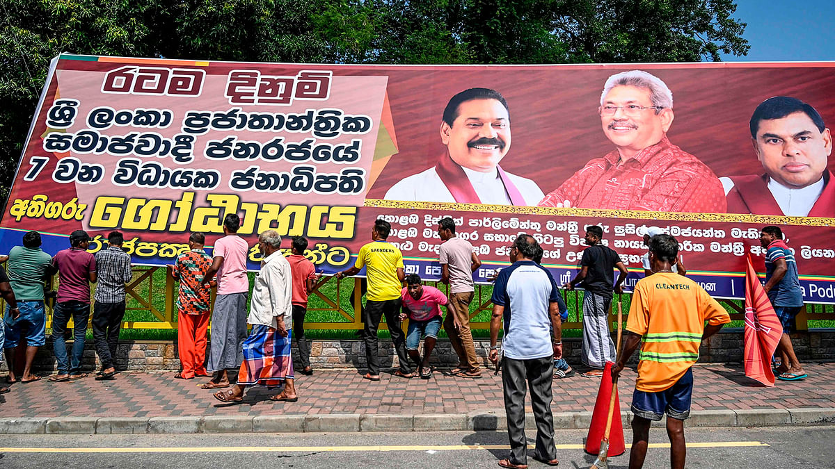 Supporters of Sri Lanka Podujana Peramuna (SLPP) party presidential candidate Gotabaya Rajapaksa carry cut-out placards to celebrate in Colombo on 17 November 2019. Photo: AFP