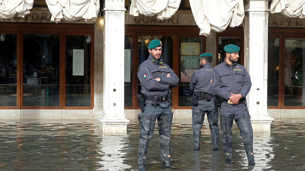 Italian police officers patrol St. Mark’s Square after days of flooding in Venice, Italy, on 16 November 2019. Photo: Reuters