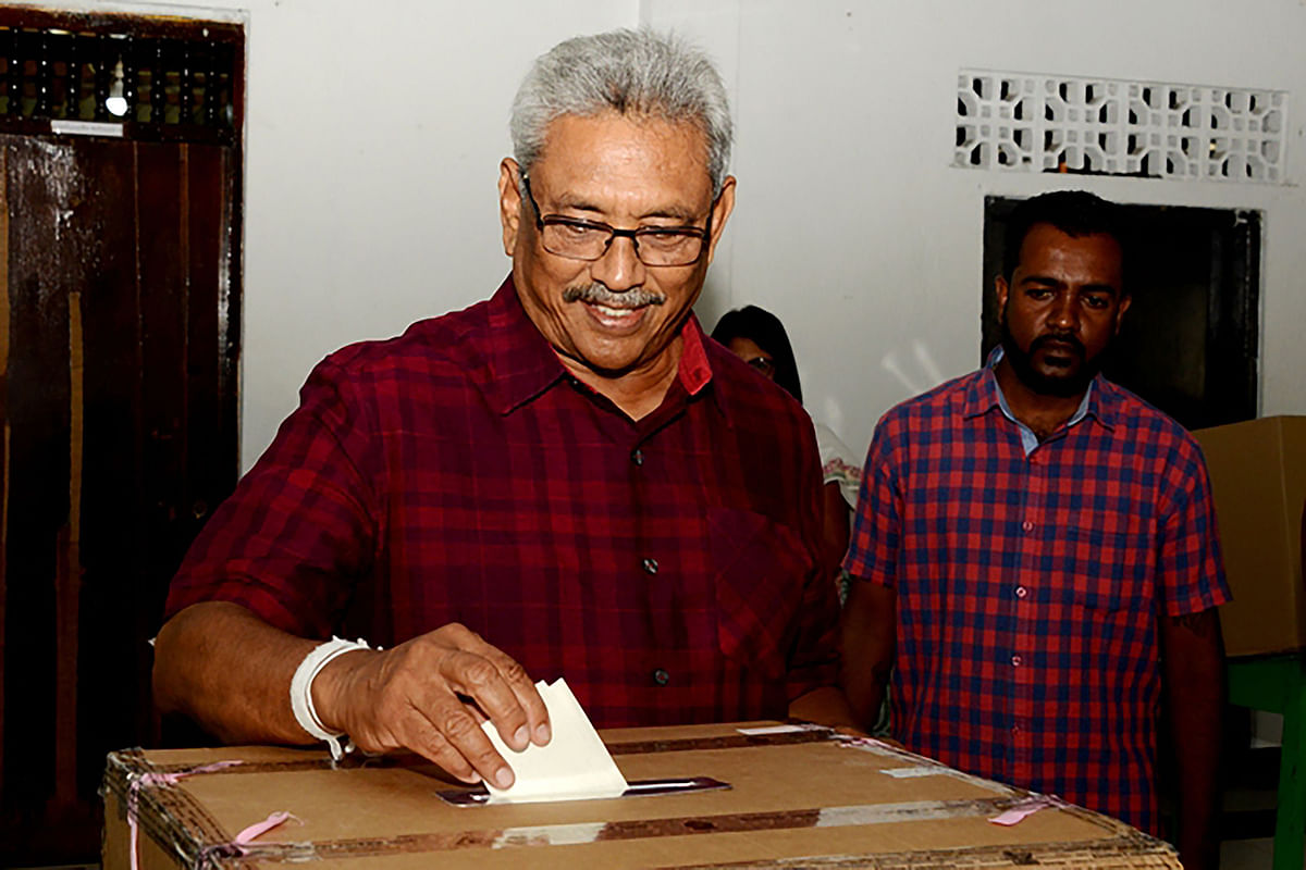 In this handout photo taken and released on 16 November 2019 by the Election Commission of Sri Lanka, Sri Lanka Podujana Peramuna (SLPP) party presidential candidate Gotabaya Rajapaksa casts his vote at a polling station during the country`s presidential election in Colombo Sri Lankans voted on 16 November for a new president in what could mark a comeback for the Rajapaksa clan, lauded by supporters for crushing the Tamil Tigers but condemned by critics for war crimes, corruption and cosying up to China. Photo: AFP