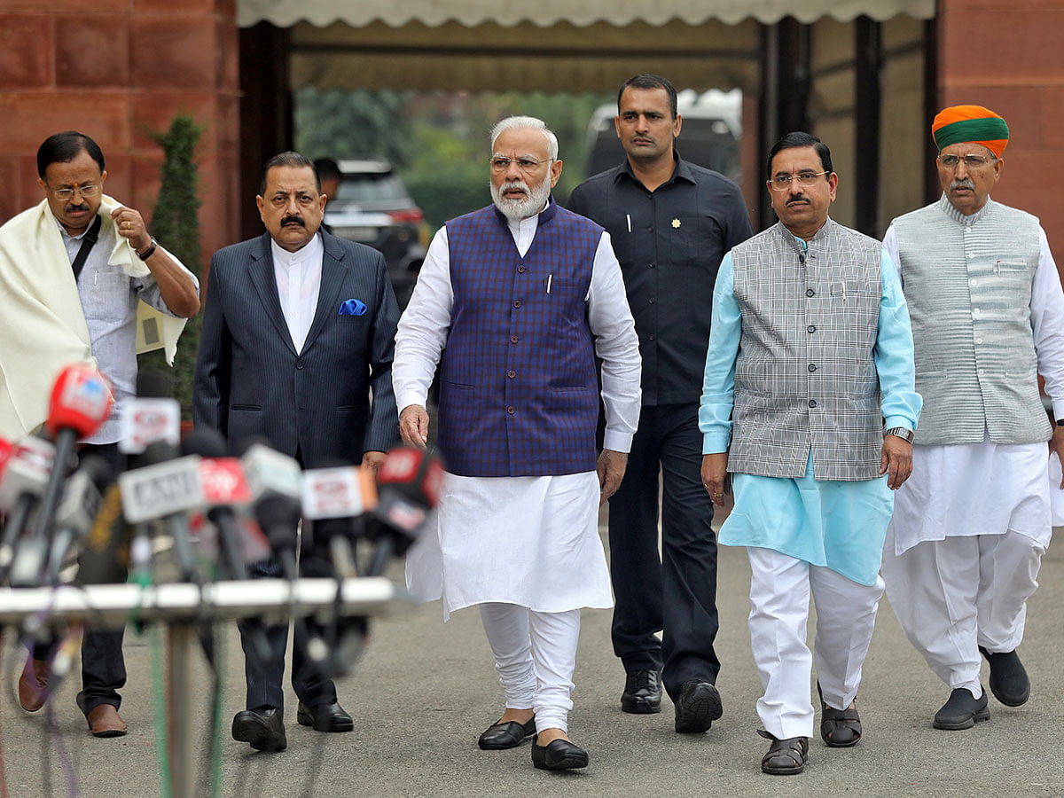India`s PM Modi walks to speak with the media after arriving at the Parliament on the first day of the winter session in New Delhi. Photo: Reuters