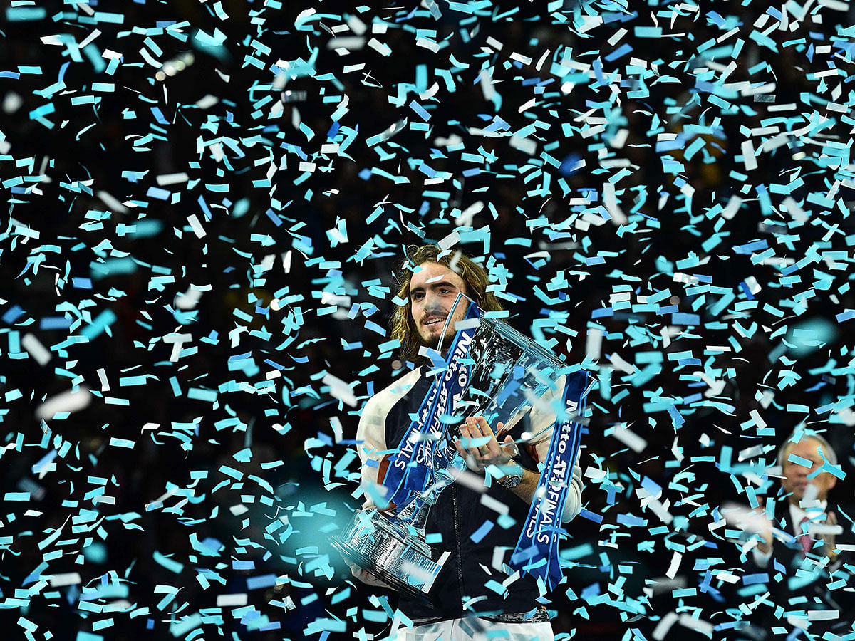 Greece`s Stefanos Tsitsipas poses with the winner`s trophy to after the men`s singles final match on day eight of the ATP World Tour Finals tennis tournament at the O2 Arena in London on 17 November 2019. Tsitsipas beat Austria`s Dominic Thiem to win the match 6-7, 6-2, 7-6. Photo: AFP