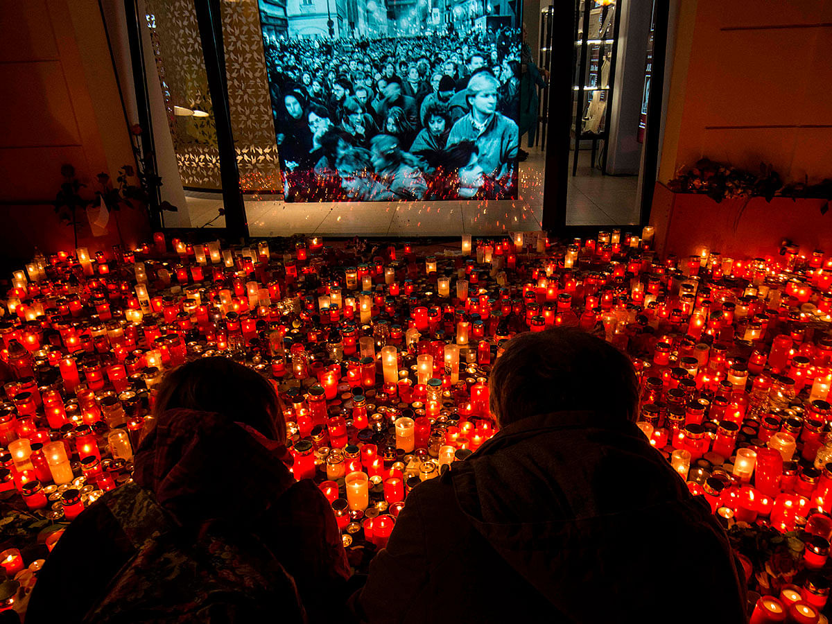 People place candles at a memorial to commemorate the 30th anniversary of the so-called Velvet Revolution on 17 November 2019 in Prague. Photo: AFP