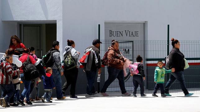 Migrants walk to enter the United States border and customs facility to apply for asylum, in Tijuana, Mexico on 19 June. Photo: Reuters