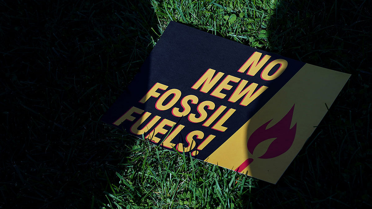 A sign protesting fossil fuels is seen on the lawn outside of the US Capitol as actor and activist Jane Fonda leads the `Fire Drill Fridays` protest in Washington, US on 18 October. Photo: AFP