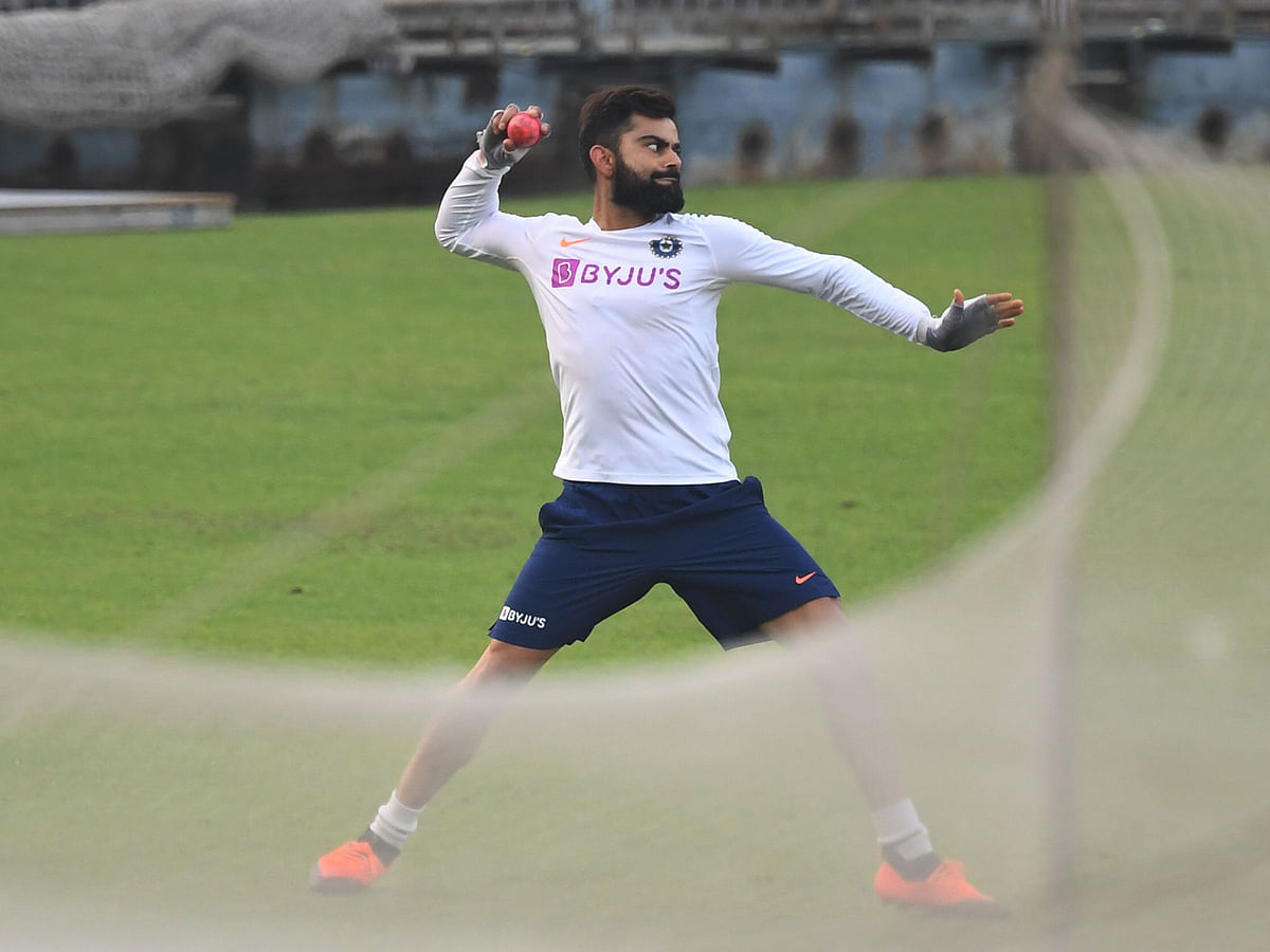 India`s cricket team captain Virat Kohli bowls during a practice session at The Eden Gardens cricket stadium in Kolkata on 20 November 2019, ahead of the second Test cricket match between India and Bangladesh. Photo: AFP