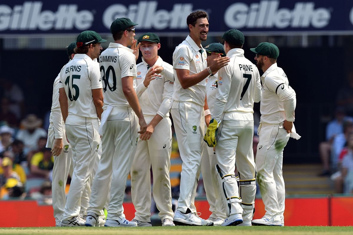 Australia`s paceman Mitchell Starc (3rd R) celebrates the dismissal of Pakistan`s batsman Haris Sohail on day one of the first Test cricket match between Pakistan and Australia at the Gabba in Brisbane on 21 November 2019. Photo: AFP
