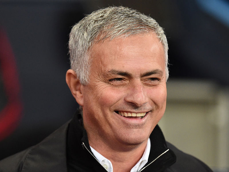 Jose Mourinho smiles before the English Premier League football match between Manchester City and Manchester United at the Etihad Stadium in Manchester, north west England. AFP file photo