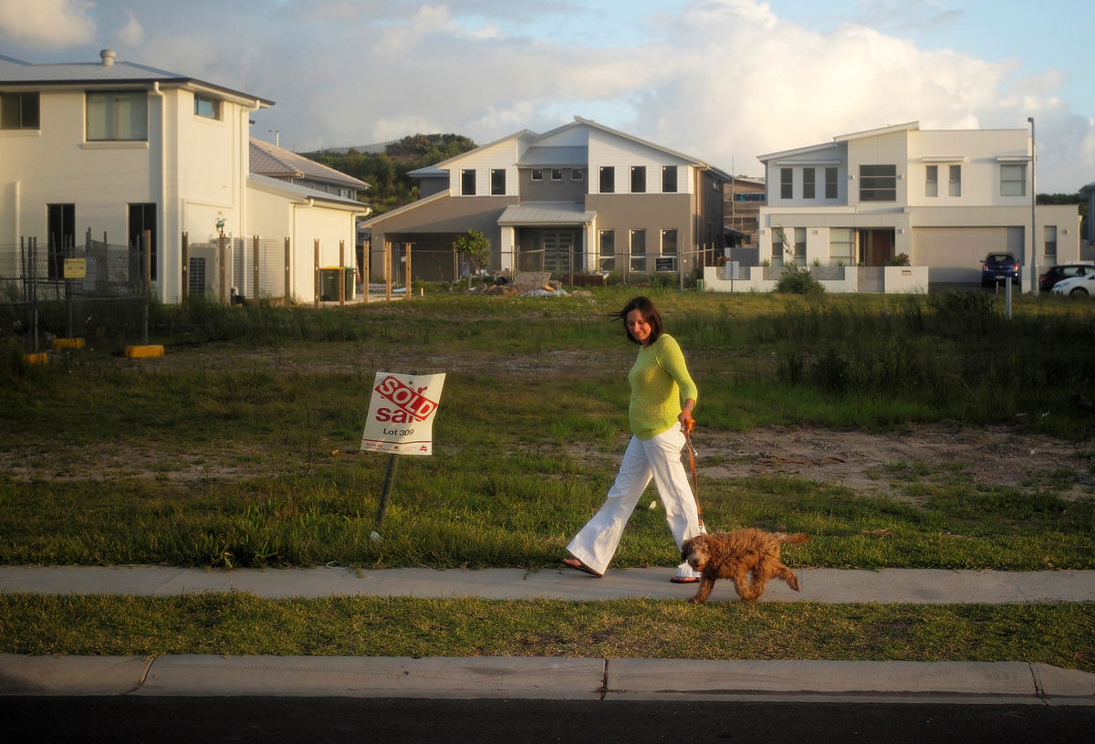 A resident in Sydney`s newly-developed beachside suburb of Green Hills walks her dog on 2 February 2015. Reuters File Photo
