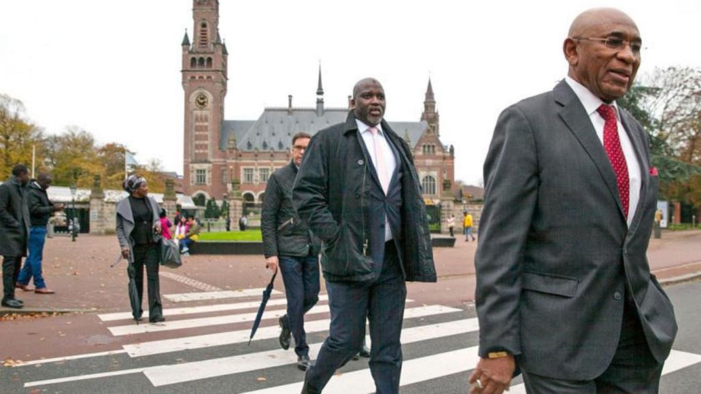 Gambia`s Abubakr Tambadou leaves International Court of Justice at The Hague, Netherlands.