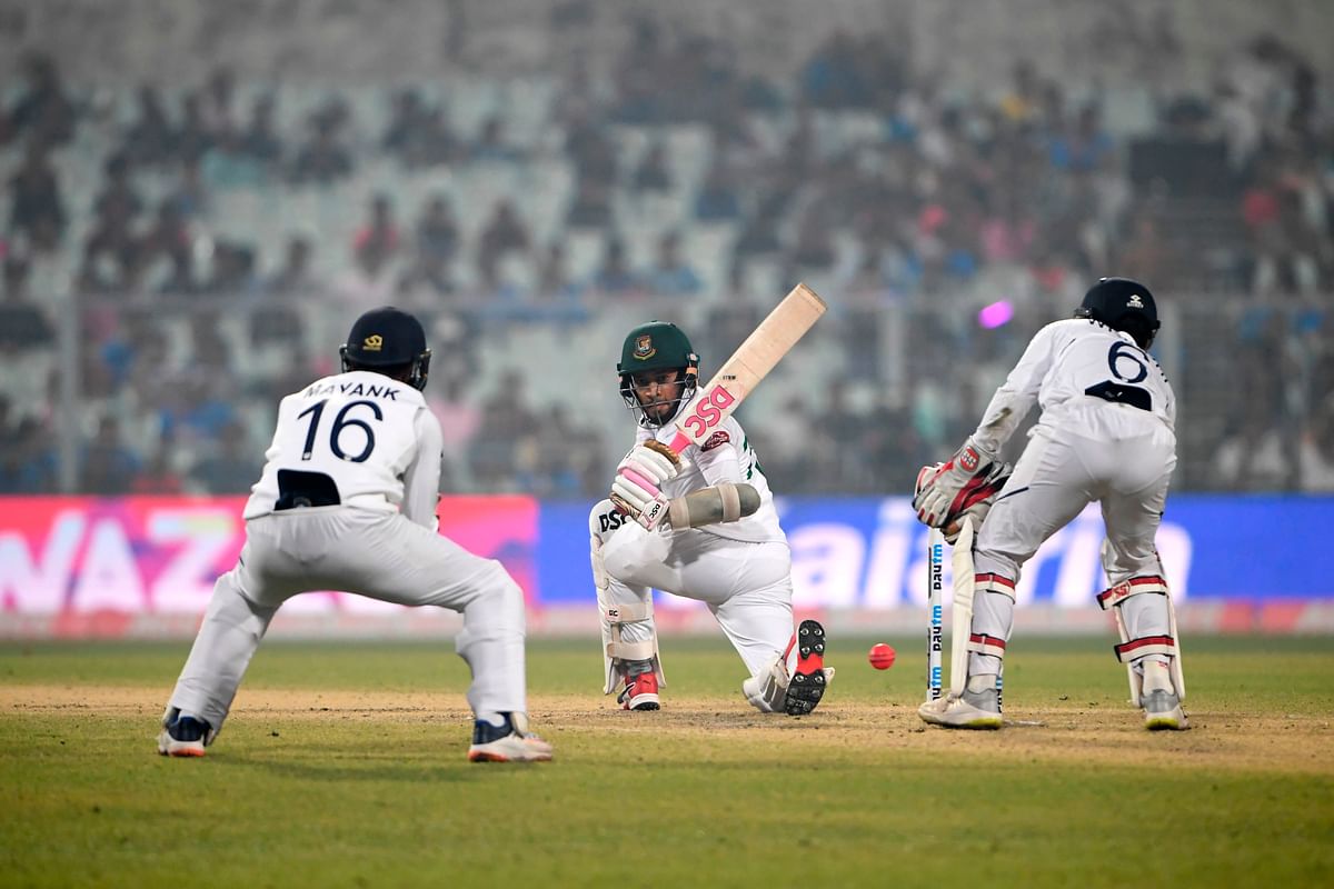 Mushfiqur Rahim (C) plays a shot during the second day of the second Test cricket match of a two-match series between India and Bangladesh at the Eden Gardens cricket stadium in Kolkata on 23 November, 2019. Photo: AFP.
