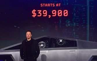 Tesla co-founder and CEO Elon Musk stands in front of the newly unveiled all-electric battery-powered Tesla`s Cybertruck at Tesla Design Center in Hawthorne, California on 21 November 2019. Photo: AFP