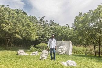 Togolese visual artist Sadikou Oukpedjo poses at the former Palace of Governors of Lome has been converted into a center of art and culture on 22 November 2019. Photo: AFP