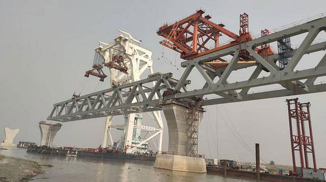 The 17th span of the Padma Multipurpose Bridge is installed Tuesday at Mawa point making 2.55 kilometres visible out of total 6.15km of the main structure of the bridge. Photo: Collected