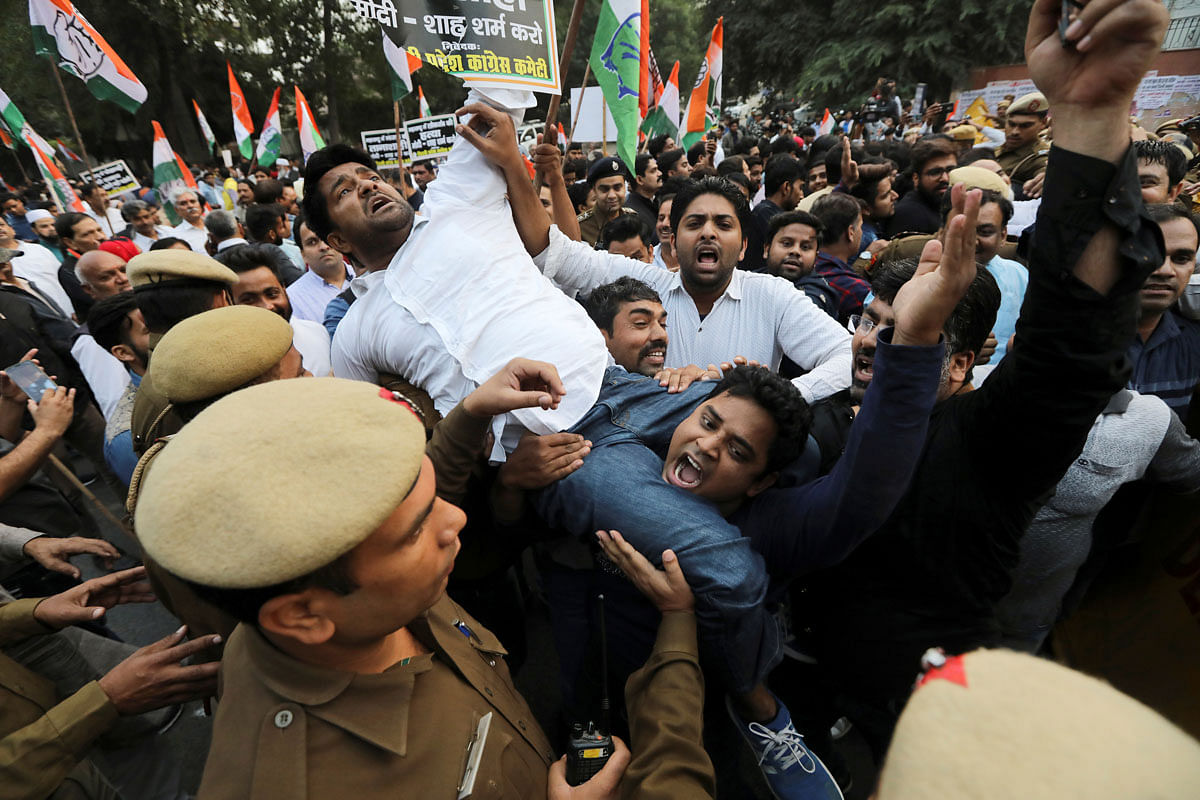 Supporters of India’s main opposition Congress party shout slogans as they are stopped by police during a protest against the formation of a Bharatiya Janata Party (BJP) led coalition government in Maharashtra, in New Delhi, India on 25 November 2019. Photo: Reuters