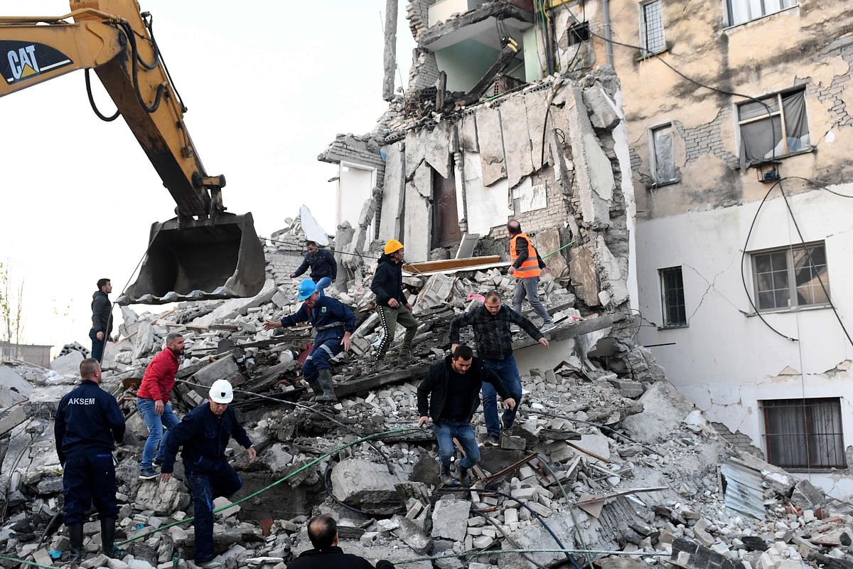 Emergency workers clear debris at a damaged building in Thumane, 34 kilometres (about 20 miles) northwest of capital Tirana, after an earthquake hit Albania, on 26 November 2019. Photo: AFP