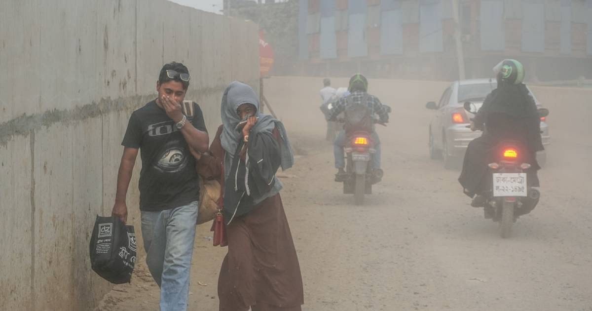 People trying hard to avoid inhaling dust directly while walking at Postogola Bridge in Dhaka. The capital has long been grappling with air pollution. Photo: Adnan Adid/UNB