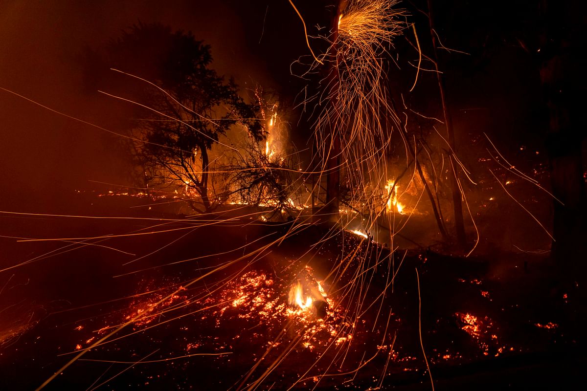 Wind blows embers as the Cave fire burns a hillside in Santa Barbara, California on 26 November 2019. Photo: AFP