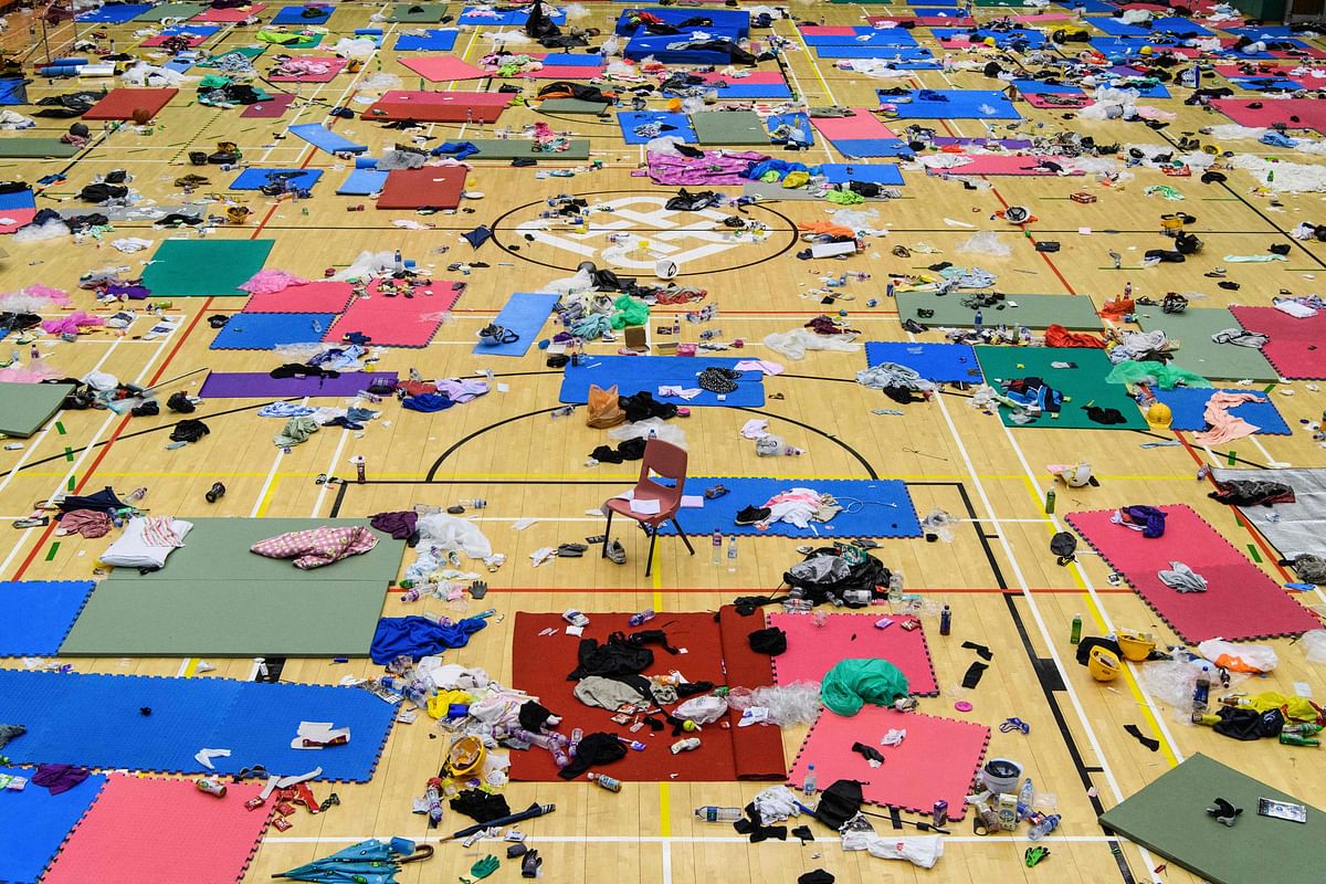 Scattered clothes, protective gear and other objects are seen in a basketball hall in the Hong Kong Polytechnic University in the Hung Hom district of Hong Kong on 26 November 2019, over a week after police surrounded the building while protesters were still barricaded inside. Photo: AFP
