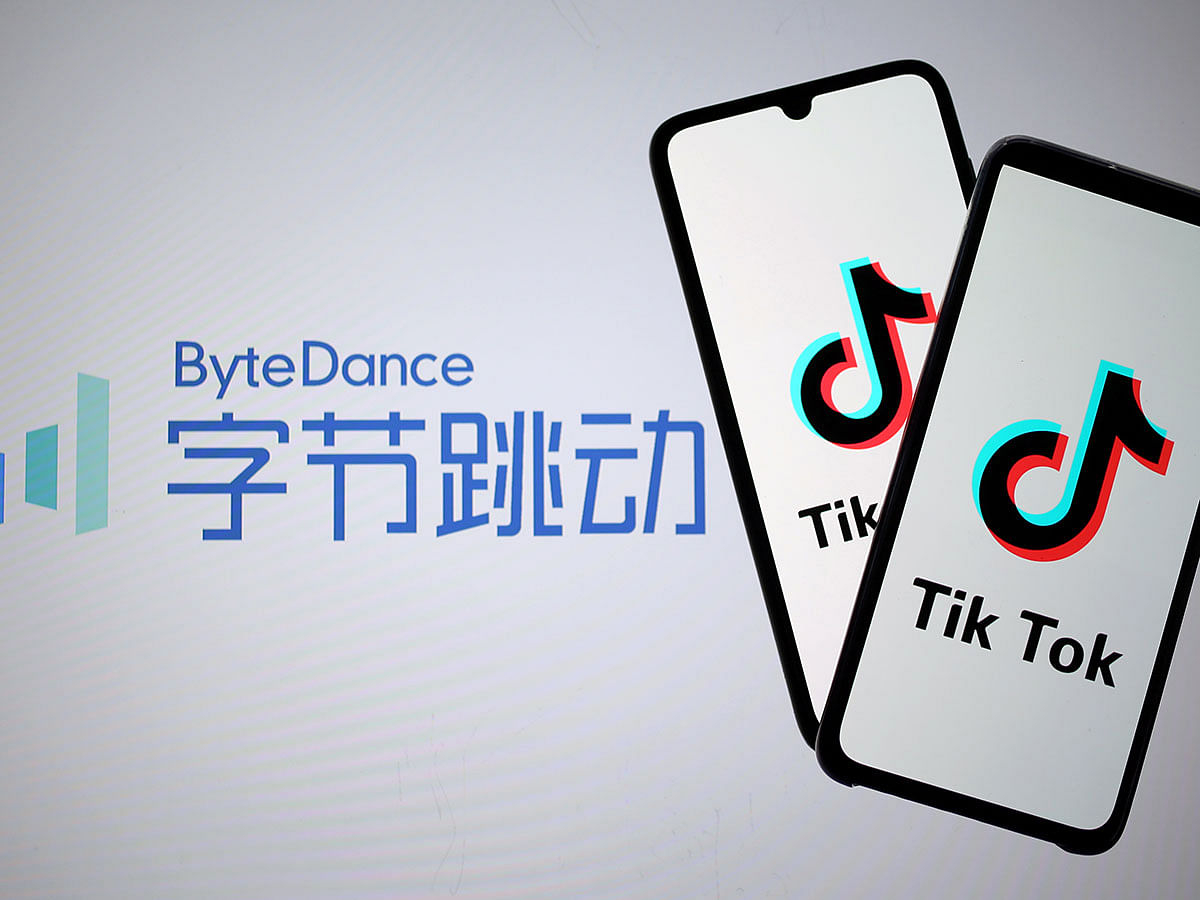 Tik Tok logos are seen on smartphones in front of a displayed ByteDance logo in this illustration taken on 27 November 2019. Reuters Illustration