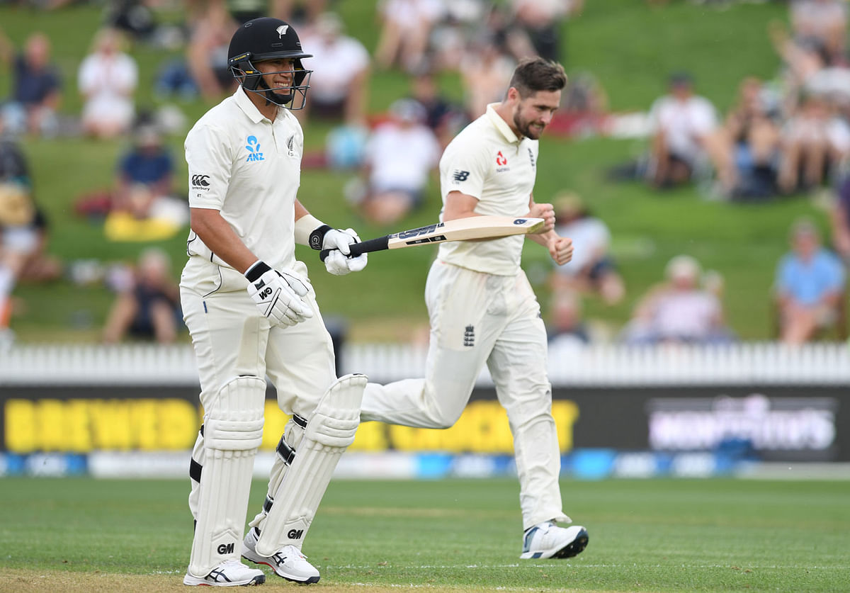 New Zealand`s Ross Taylor walks off the pitch after his wicket while England`s Chris Woakes celebrates in Second Test at Seddon Park, Hamilton, New Zealand on 29 November 2019. Photo: Reuters