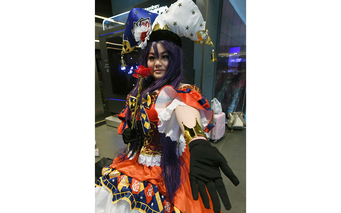 A cosplayer poses on the first day of the three-day Anime Festival Asia in Singapore on November 29, 2019. Cosplay -- short for `costume play`, is a subculture originating from Japan with a now global cult following where hobbyists dress as `Gothic Lolitas` and other often manga-inspired characters. Photo: AFP