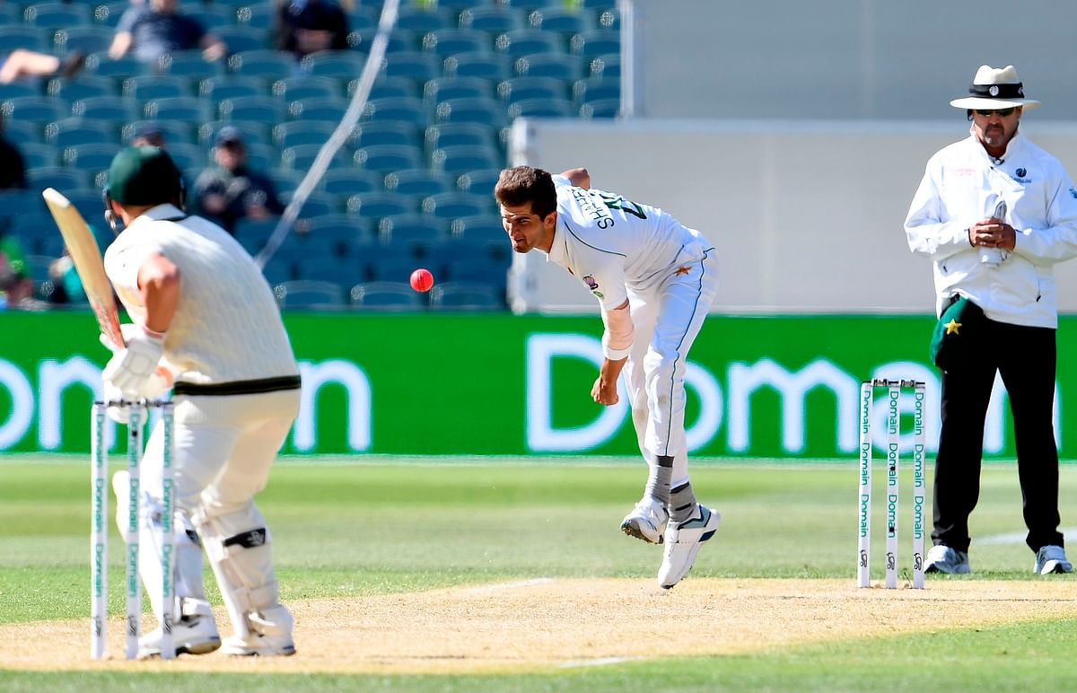 Pakistan`s paceman Shaheen Afridi (C) bowls to Australia`s batsman David Warner during the day two of the second cricket Test match between Australia and Pakistan in Adelaide on 30 November 2019. Photo: AFP