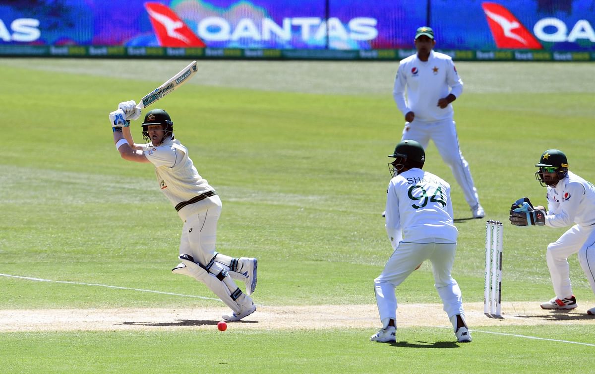 Australia`s Steve Smith (L) plays a shot during the day two of the second cricket Test match between Australia and Pakistan in Adelaide on 30 November, 2019. Photo: AFP