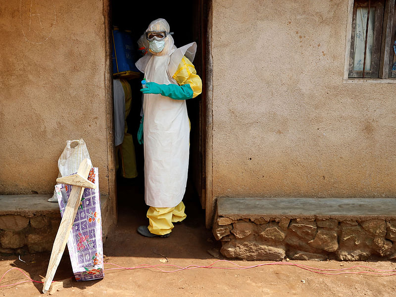 Healthcare workers enter a house where a baby suspected of dying of Ebola is, during the funeral in Beni, North Kivu Province of Democratic Republic of Congo, on 18 December 2018. Reuters File Photo