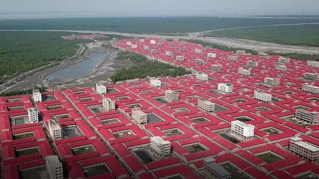 In this handout aerial photo taken on 19 June 2019 and released on 21 October by Mukta Dinwiddie MacLaren Architects shows buildings intended to accommodate members of the Rohingya refugee community on the silt islet Bhashan Char in the Bay of Bengal. Photo: AFP