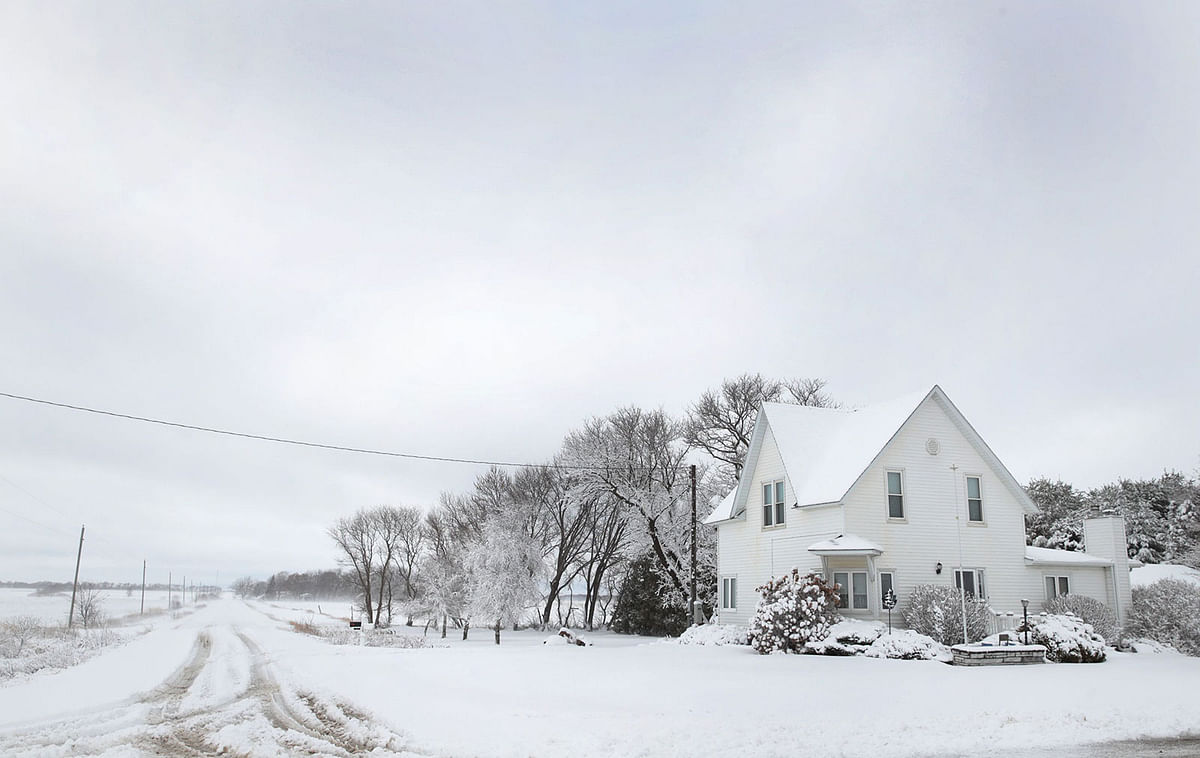 Snow covers a rural road on 27 November 2019 near Rudd, Iowa. A winter storm, which dumped rain, ice, snow and brought high winds into much of the upper Midwest, has been hampering holiday travel by road and by air on one of the busiest travel days of the year. Photo: AFP